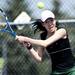 Huron #1 singles player Isabel Zheng backhands a ball on Saturday, April 27. Daniel Brenner I AnnArbor.com